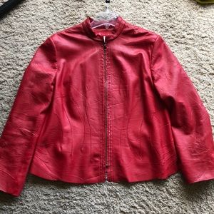 Used red leather jacket. Very flattering.